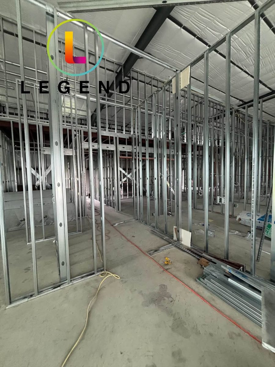 Framed rooms and doorways at the Clearview Dental build-out in Austin, Texas, before walls are closed in.
