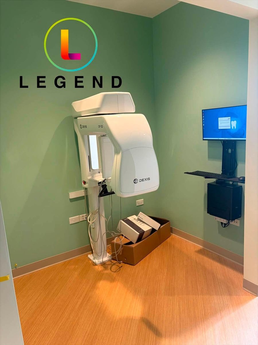 Imaging room at Little Roots Pediatric Dentistry, with dental imaging equipment and a wall-mounted computer workstation during setup.