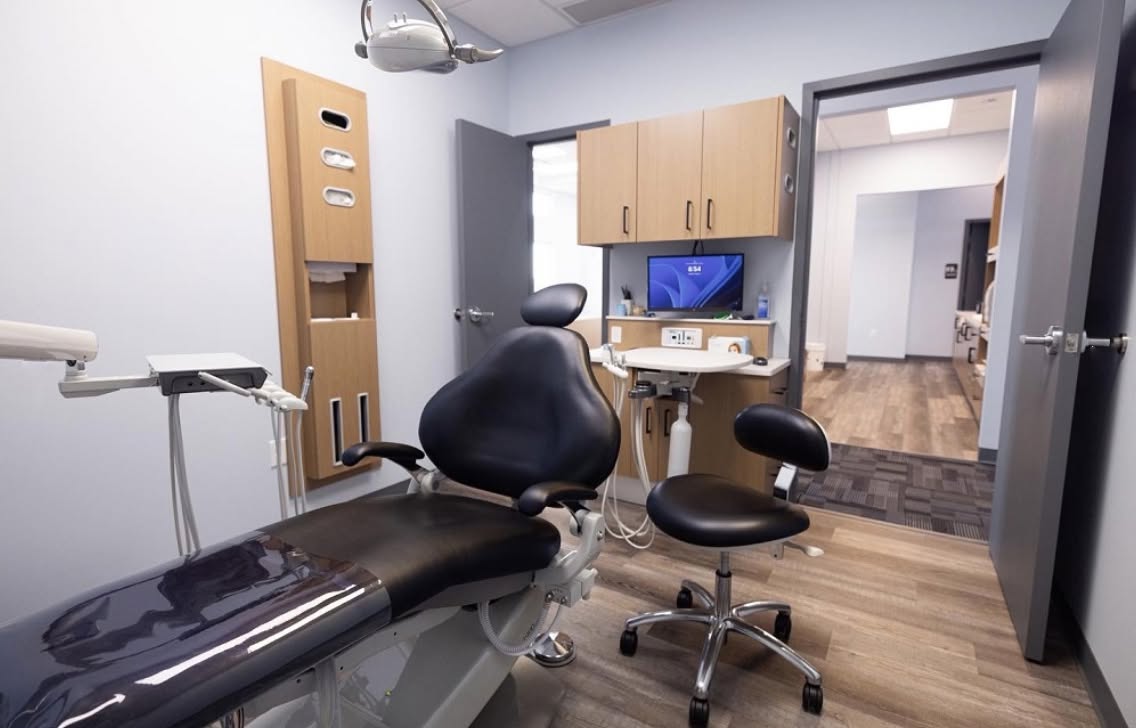 Dental chair and display in a Blue Skies Pediatric Dentistry treatment room.