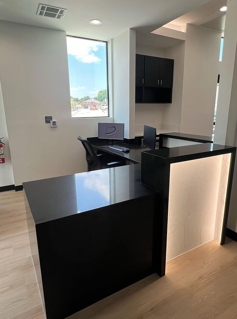 Reception workstations at Dental Plus Specialists.