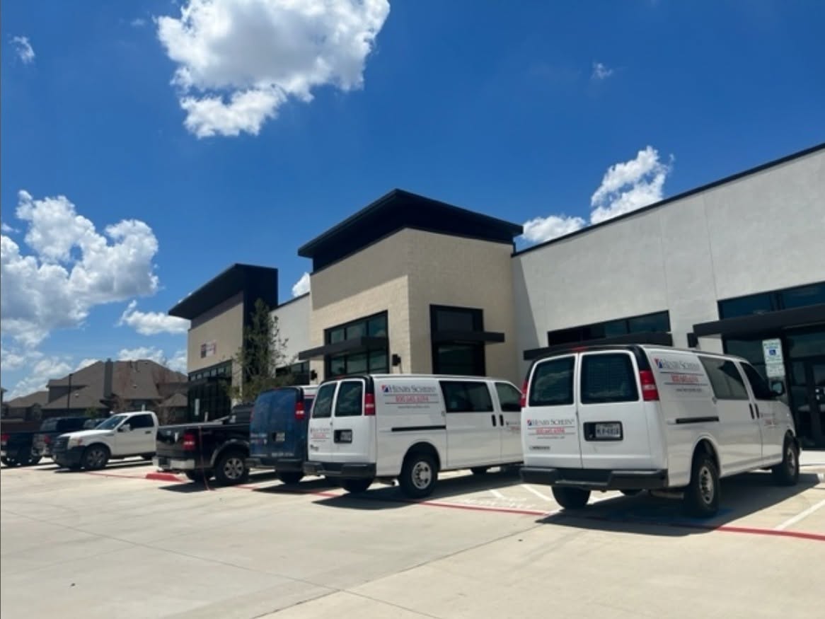 Everlasting Dentistry project exterior with service vehicles outside.