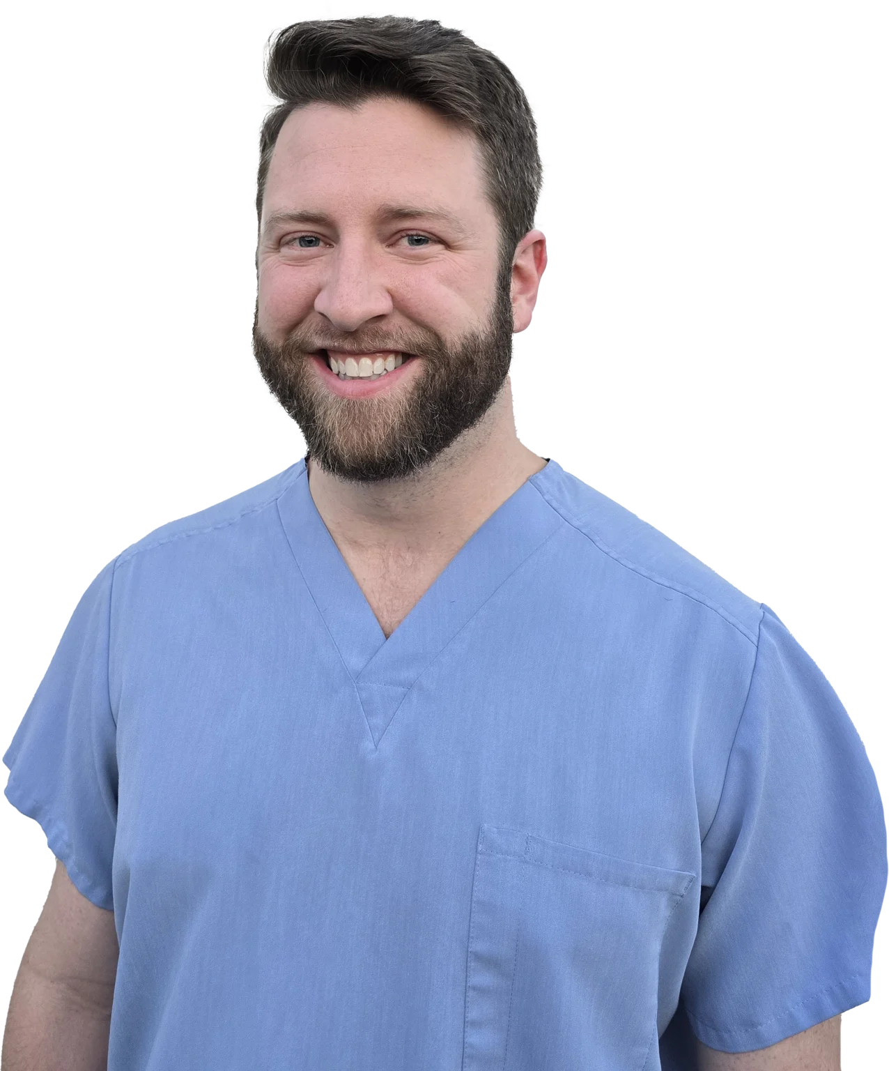 Dr. Collin Burns of Happy Harbor Pediatric Dentistry wearing blue scrubs.