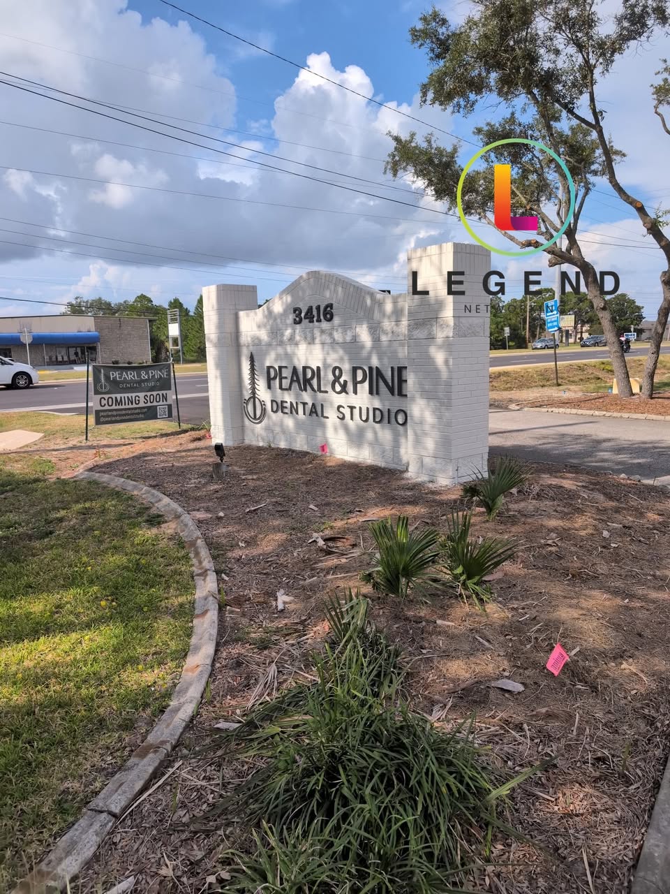 Pearl & Pine Dental Studio roadside sign.