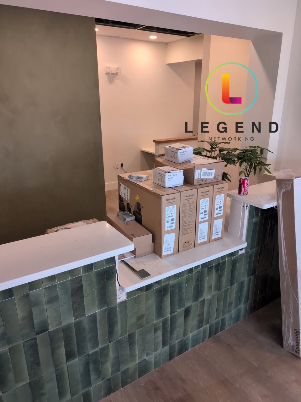 Reception and boxed equipment during the Pearl & Pine Dental Studio setup.
