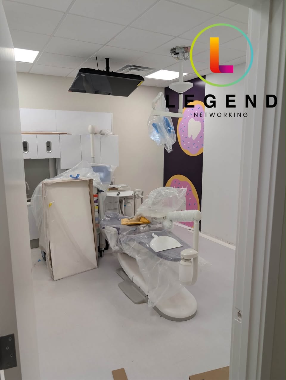Dental chair and ceiling display during the Sweet Street Pediatric Dentistry installation.