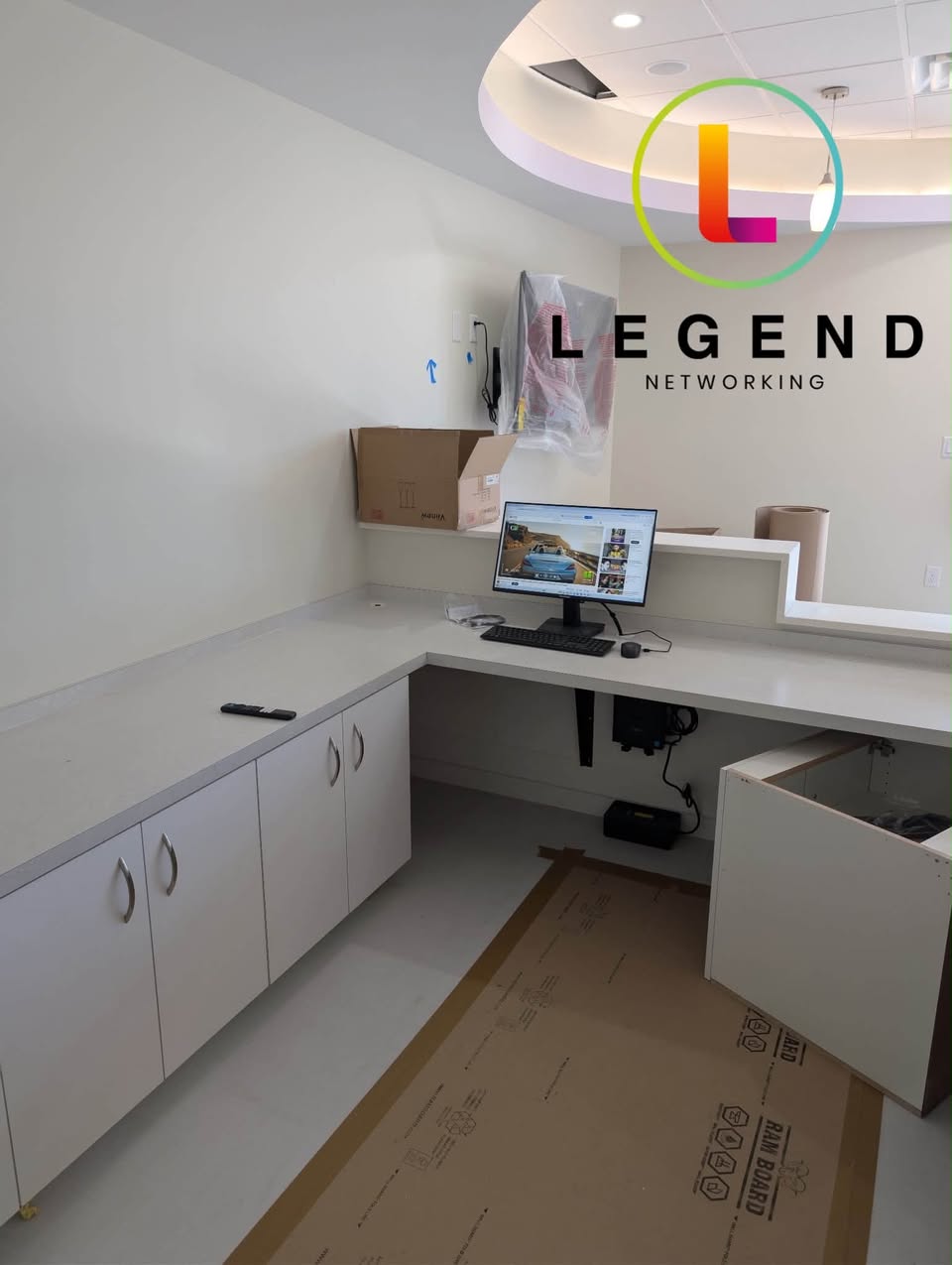 Computer workstation and cabinetry during the Sweet Street Pediatric Dentistry setup.
