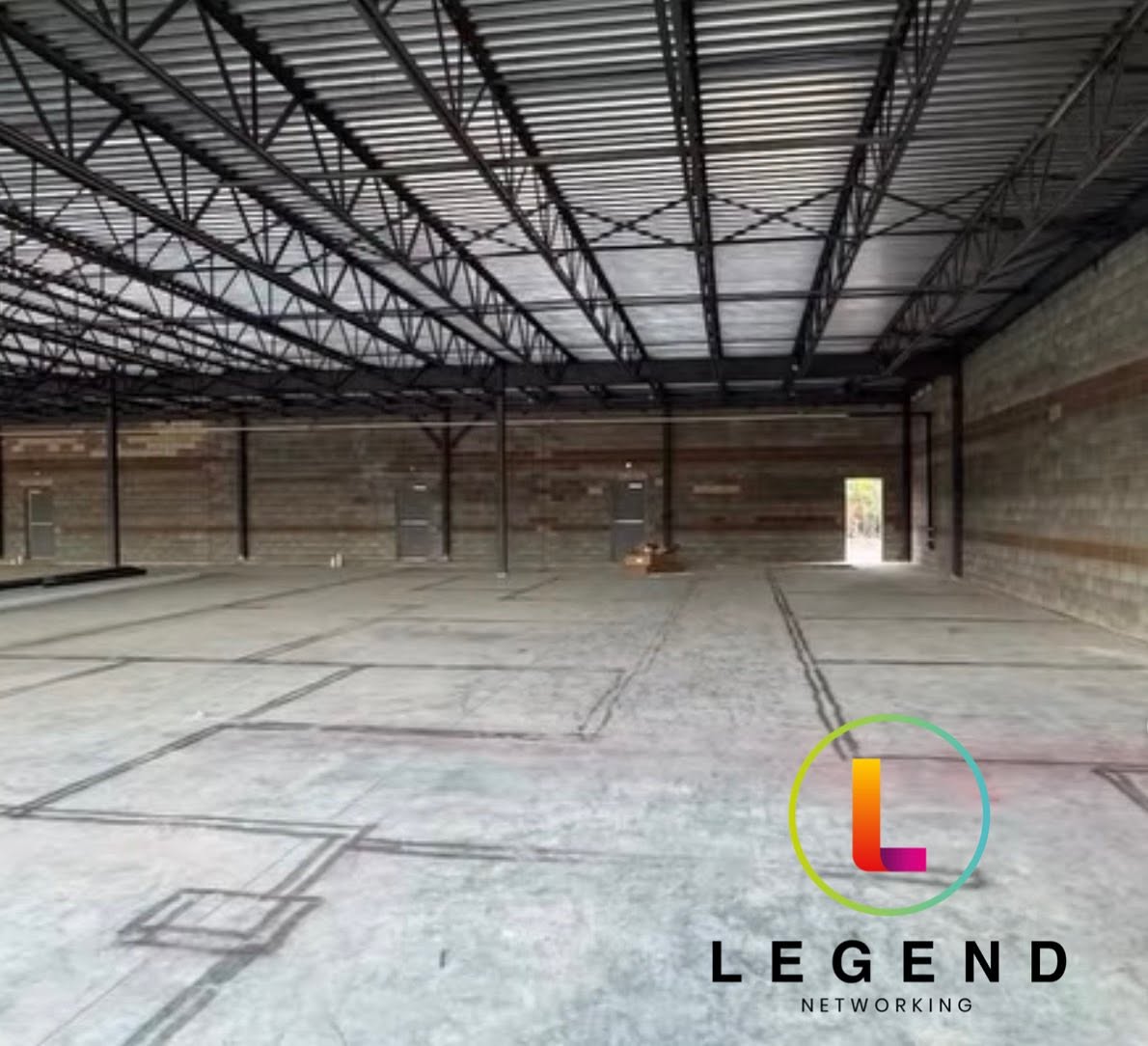 Empty commercial shell before the Thriving Smiles Dental interior buildout.