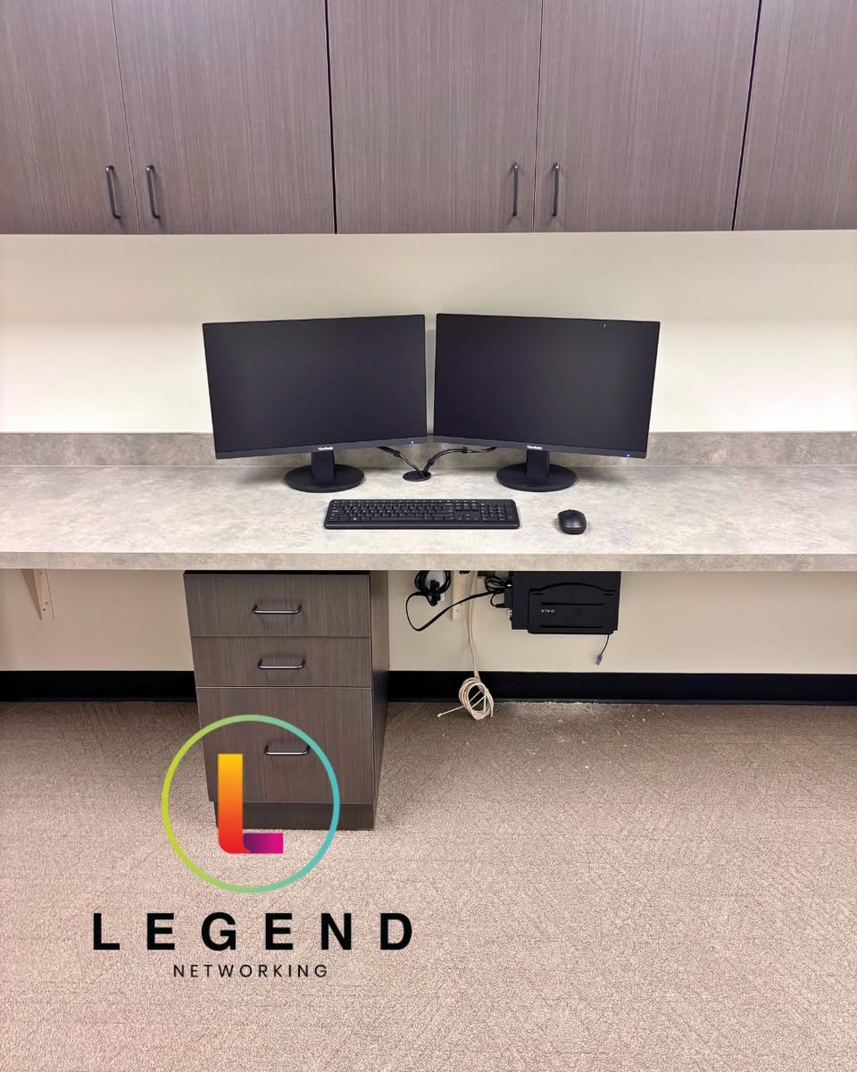 Dual-monitor workstation at Trinity Valley Oral Surgery in Fate.