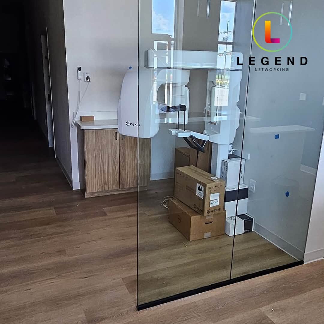 Dental imaging equipment and boxed supplies during the Young Horizon Dental installation.