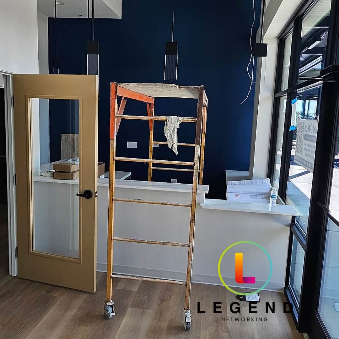 Reception buildout at Young Horizon Dental, with equipment and a ladder during installation.